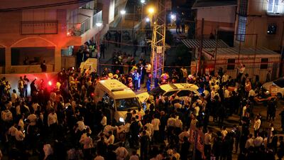 Crowds gather at the scene after five people were killed by a gunman on a main street in Bnei Brak, near Tel Aviv, on Tuesday. Reuters