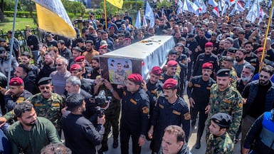 Members of Iraq's Hashed al-Shaabi carry the casket of Hussein Fadhel Ali who was killed in a strike earlier in the week, during the funeral in Baghdad's Sadr City. AFP