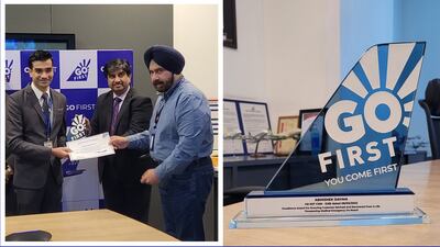 Abhishek Dayma, cabin crew, receives an 'excellence award' from the airline.