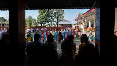 Women in Dharamshala, Himchal Pradesh, queue to cast their votes. AP Photo