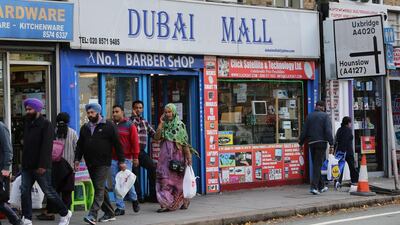 London's 'Dubai Mall' provokes laughter among any passers-by who have been to the real mall and shopkeepers say many tourists stop to take photos beneath the signage. Stephen Lock for The National