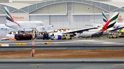 An Emirates Boeing 777-300 was gutted by fire at Dubai international airport. An investigation into the cause of the crash landing is under way. EPA