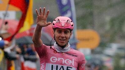 UAE Team Emirates' Tadej Pogacar celebrates after crossing the finish line to win Stage 16 of the Giro d'Italia on May 21, 2024. Reuters