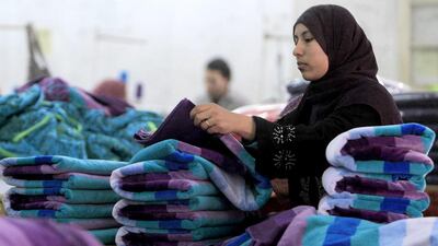 Manufacturers fear competition from low-cost exporters such as Bangladesh will destroy their industries if they have to increase workers’ salaries. Mohamed Abd El Ghany / Reuters