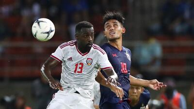 The UAE's Ahmed Barman, left, and Teerasil Dangda of Thailand. Reuters