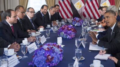 US President Barack Obama, far right, meets with Egyptian president Abdel Fattah El Sisi, far left, in New York on September 25, 2014 at the sidelines of the UN General Assembly. The US and Egypt seem to be setting aside differences as cooperation against threats such as ISIL outweigh Washington's concerns about Egypt's domestic politics. Saul Loeb/AFP Photo