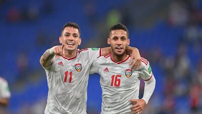 UAE forward Caio Canedo celebrates with teammate Ali Saleh after opening the scoring against Syria.