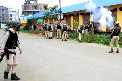 Security personnel fire tear gas during a protest in Imphal by Manipur's Meitei community on May 4. AFP
