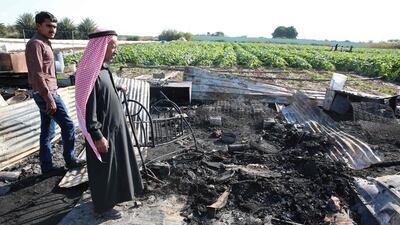 The remains of a home where several Pakistani farmers were killed in a fire in the town of Shuna in Jordan. AFP