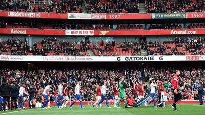 The two teams make their way on to the pitch ahead of the Premier League match between Arsenal and Crystal Palace at the Emirates Stadium on April 17, 2016 in London, England. (Photo by Mike Hewitt/Getty Images)