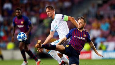 epa07030612 Barcelona's Ivan Rakitic in action against PSV's Luuk de Jong. EPA