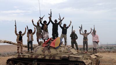 Militias loyal to Yemeni president Abdo Rabbo Mansour Hadi stand on a tank positioned in Lahj, Yemen. EPA