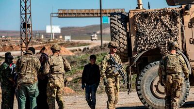 US soldiers patrol a road in the town of Tal Tamr in the northeastern Syrian Hasakeh province on the border with Turkey. AFP