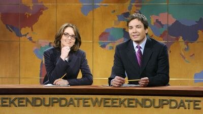 In this May 10, 2003 image released by NBC, Tina Fey, left, and Jimmy Fallon appear during the Weekend Update segment. Mary Ellen Matthews / AP Photo / NBC