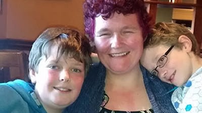 Jack Sykes, 12 (left), and his brother Paul, nine, with their mother Claire. Shutterstock