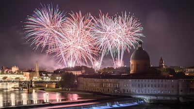 Fireworks explode over the Garonne River, as part of the annual Bastille Day celebrations, in Toulouse, south-western France. AFP