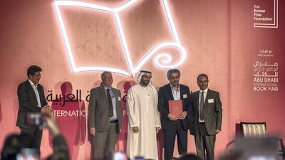 From to left to right Ibrahim Al Saafin , HE Mohamed Khalifa Al Mubarak, Winner Ibrahim Nasrallah for the "The Second War of the Dog" Professor Yasir Suleiman of International Prize for Arabic Fiction which held in Abu Dhabi. Vidhyaa for The National