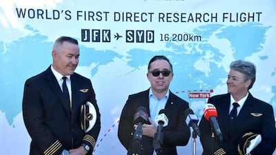 Qantas pilot Captain Sean Golding, group chief executive Alan Joyce and fleet manager Lisa Norman speak to the media after completing the flight. AFP