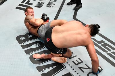 Jack Hermansson secures a heel hook submission against Kelvin Gastelum in their middleweight bout on Fight Island. Getty