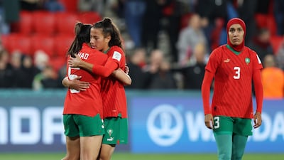 Nesryne El Chad, left, and Sarah Kassi embrace after losing to France in the Women's World Cup with Nouhaila Benzina in the background. Sarah Reed / Getty Images