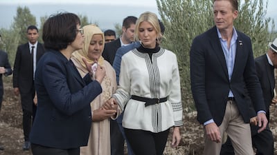 Ivanka Trump, wearing a black-and-white Fadila El Gadi tunic, meets local farmers in Sidi Kacem province, Morocco on November 7, 2019. EPA