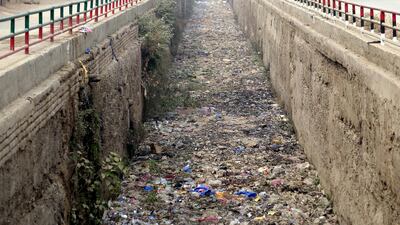 Litter clogs a sewer drain in Peshawar, Pakistan. EPA