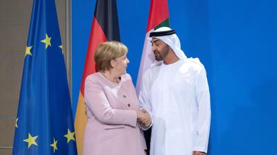 Sheikh Mohamed bin Zayed, Crown Prince of Abu Dhabi and Deputy Supreme Commander of the UAE Armed Forces, stands for a photograph with Angela Merkel, Chancellor of Germany, after delivering a joint speech during his visit to Berlin in June. Mohamed Al Hammadi / Ministry of Presidential Affairs