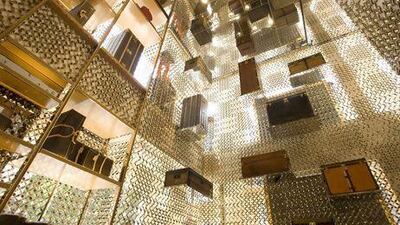 Louis Vuitton branded goods sit on display at the LVMH Moet Hennessy Louis Vuitton SA maison store in New Bond Street in London. Chris Ratcliffe / Bloomberg