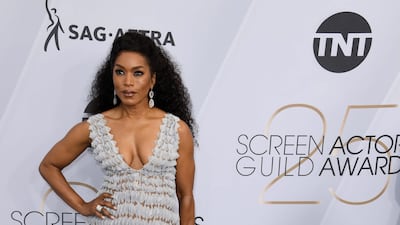 'Black Panther' star Angela Bassett wore a Georges Chakra gown with Gismondi1754 jewellery, Casadei heels and a Tadashi Shoji clutch. AFP