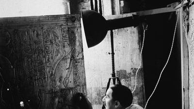 Howard Carter opens the doors of the second of four gold shrines surrounding the sarcophagus of King Tutankhamun. The discovery of the tomb is one of the most dramatic moments in archaeology. Hulton Archive / Getty Images