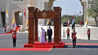 Pope Francis arrives at the Presidential Palace in Baghdad. AFP