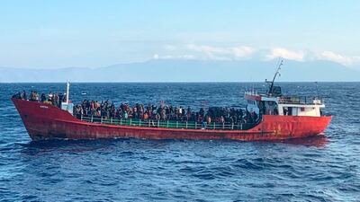 A ship with migrants near the Greek island of Crete. The UN estimates that more than 2,500 people have died or gone missing at sea attempting to reach Europe this year. AP