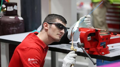 Emanuel Budeanu from Spain team, at the refrigeration and air conditioning stand, preparing for the WorldSkills Abu Dhabi 2017. Pawan Singh / The National