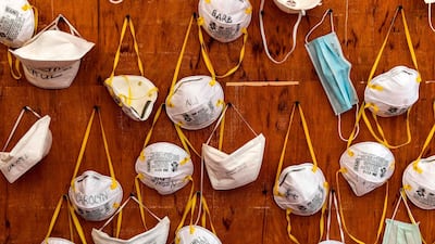 Protective masks bearing the names of medical staff are pinned to a wall at a field hospital for coronavirus patients, financed by US evangelical Christian disaster relief NGO Samaritan’s Purse, outside the Cremona hospital, Lombardy, Italy. AFP