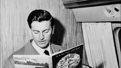 In this photo taken on July 04, 1957 French fashion designer Hubert de Givenchy reads a magazine aboard a flight in Beauvais. AFP