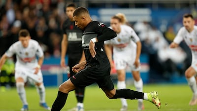Paris Saint Germain's Kylian Mbappe takes his winning penalty. EPA