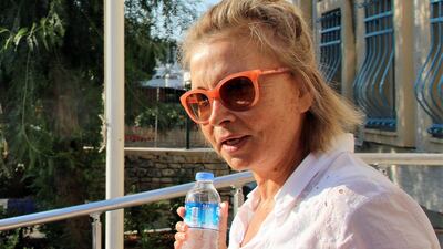 Journalist Nazli Ilicak poses in Mugla after being detained by Turkish police on July 26, 2016. Ilicak and five others were sentenced to life terms on February 16, 2018 over links to the group blamed for a failed coup in July 2016. Ilhas News Agency / AFP