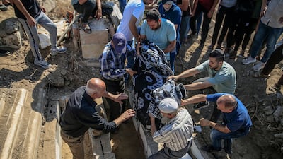 Relatives mourn members of the Al Masri family who were killed by an Israeli air strike in Gaza city on Tuesday. EPA