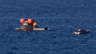 Nasa's Orion spacecraft is seen as recovery teams work to secure the spacecraft ahead of transferring Artemis II crewmembers to USS John P. Murtha in the Pacific Ocean off the coast of California. Reuters