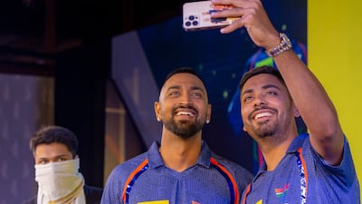 Lucknow Super Giants players Krunal Pandya, left, and Avesh Khan with their IPL 2023 jersey. @LucknowIPL / Twitter
