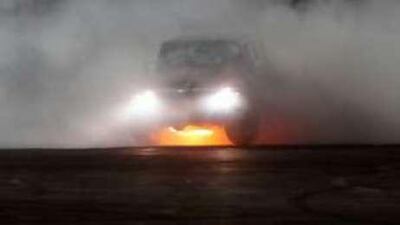 A driver performs vehicular stunts, burning tyres and making plumes of smoke, during the Gulf Car Performance Championship in Al Ain Sportplex in May.