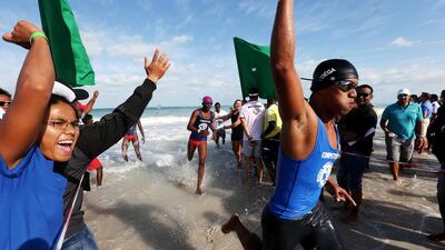 The last swimmer in the winning 200-metre relay team set to cross the line at St Regis Hotel yesterday. Christopher Pike / The National