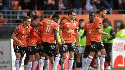Terem Moffi is congratulated by teammates after scoring. AFP