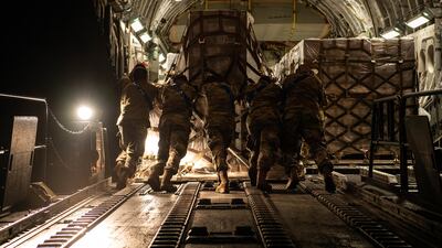Airmen loading a pallet of formula on to an aircraft at Ramstein Air Base, Germany. US Air Force / EPA
