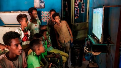 Children play video games in a shop in Dansha, Ethiopia, on November 25. AFP