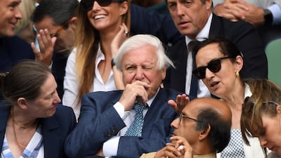 Sir David Attenborough, centre, sits in the Royal Box on Centre Court. Wimbledon always attracts a host of celebrities, but they are set to miss out this year. AP
