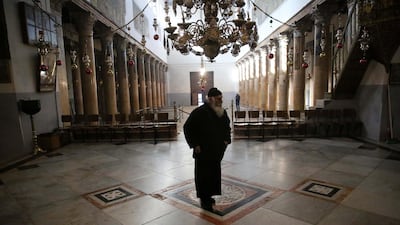 A Christian monk walks in the Church of Nativity ahead of the Christmas preparations in the West Bank city of Bethlehem. EPA