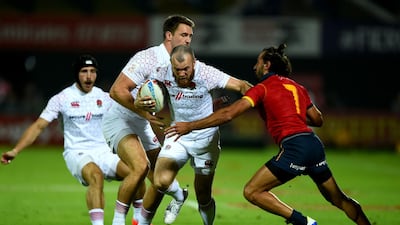 Tom Bowen of England is tackled by Pol Pla of Spain on day one of the HSBC World Rugby Sevens Series in Dubai. Getty
