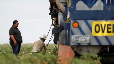 Johnny Vega (left), the president and CEO of Mico Services, has equipment lying idle that could generate $700,000 per month because he says he cannot find enough workers. Reuters