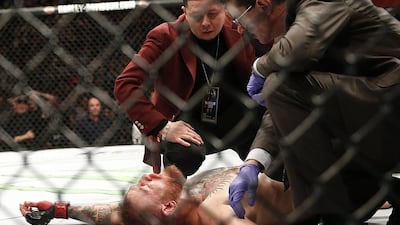 Conor McGregor recovers after a second round-submission to Nate Diaz during their welterweight mixed martial arts match at UFC 196 in Las Vegas. Eric Jamison / AP Photo
